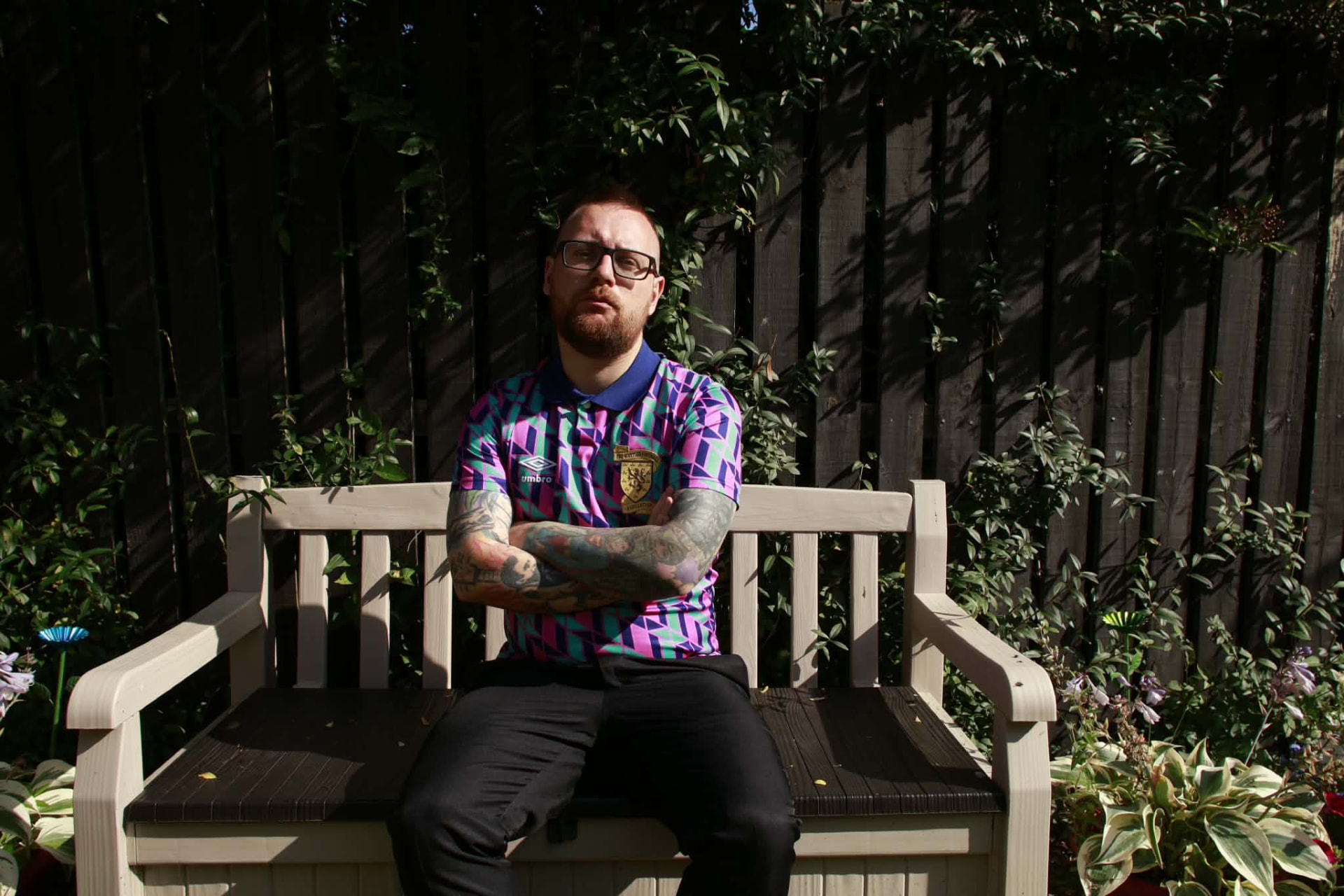 Joe Quinn sitting outdoors in the sunshine