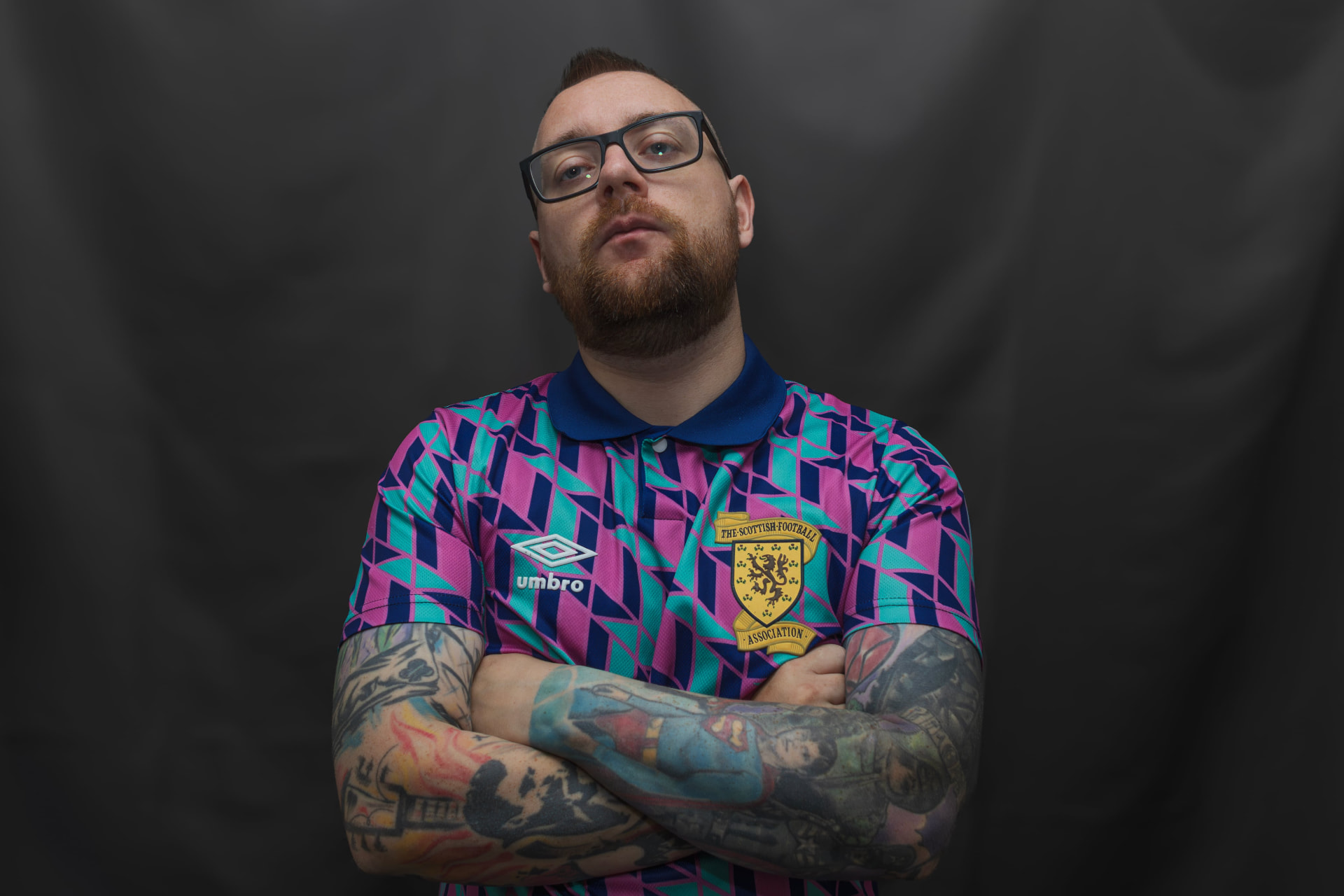 Joe Quinn in a Scotland retro shirt, arms folded